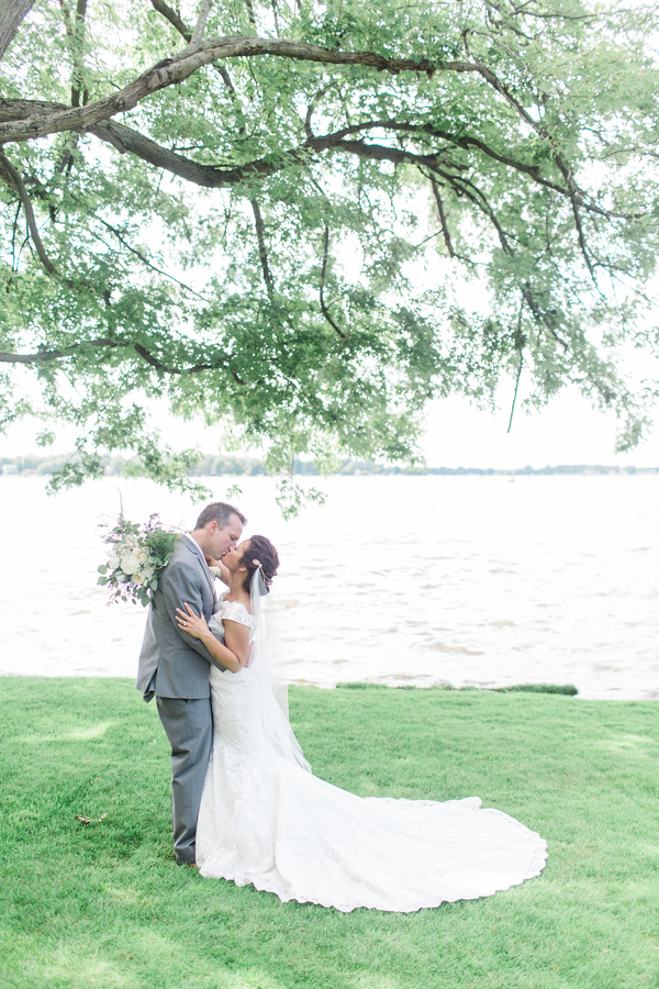 Bride and Groom Kissing Under Willow Tree